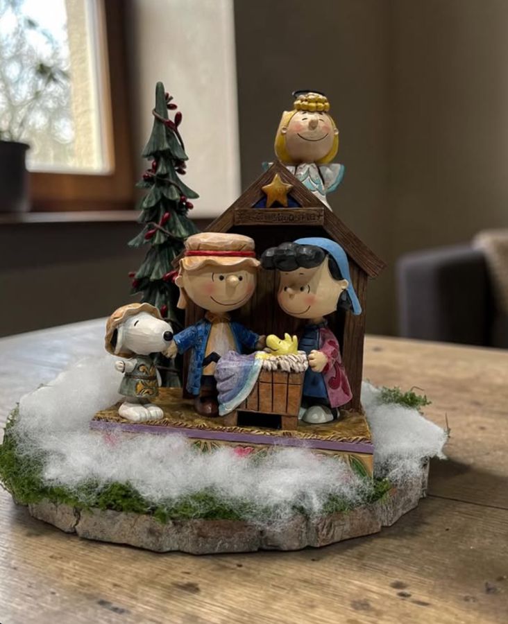 Nativity scene decor with a small tree, moss and snow